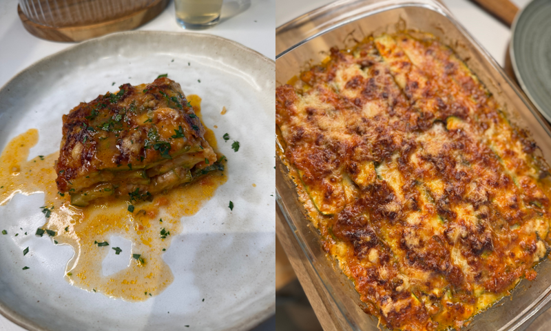 A close-up of a square slice of vegetable lasagna on a white plate, garnished with herbs, next to a baking dish filled with the remaining baked lasagna, topped with melted, golden cheese.