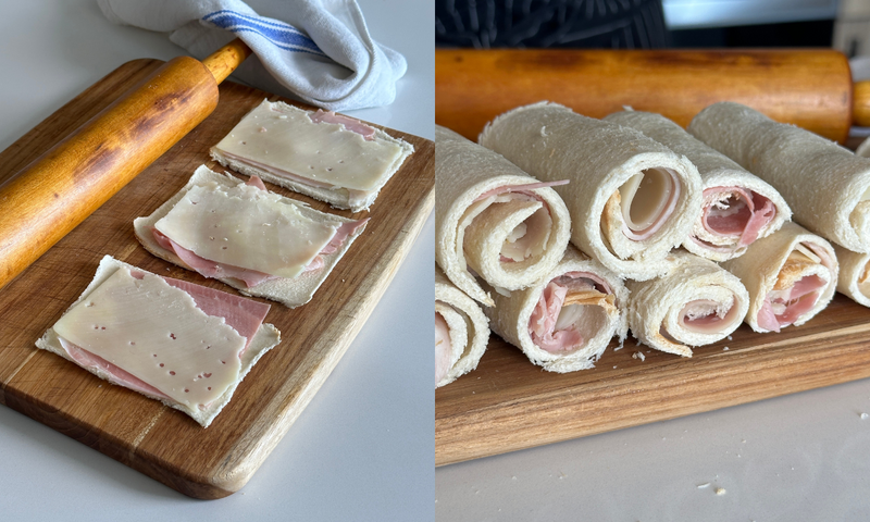 A cutting board with slices of bread topped with ham and cheese and a rolling pin; next to it, rolled-up bread with ham and cheese filling, stacked on the same board.