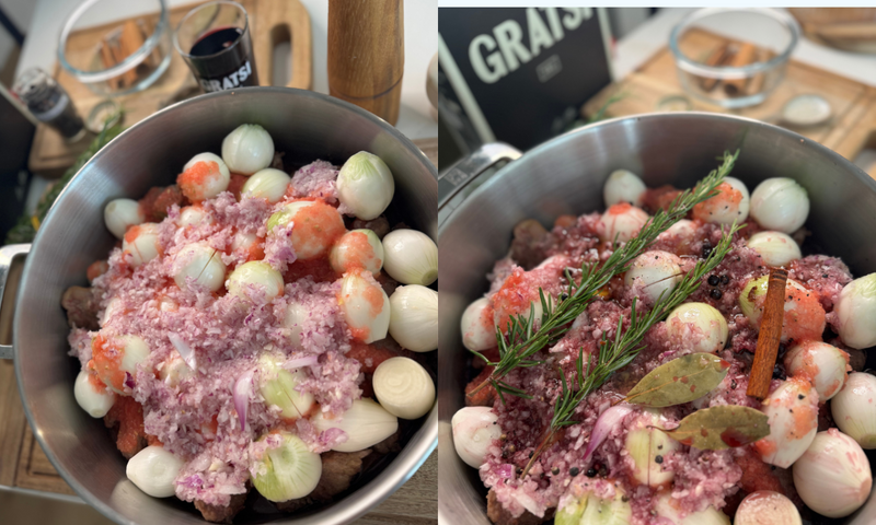 A pot filled with peeled whole onions, chopped meat, grated vegetables, herbs, bay leaves, and peppercorns, shown from two angles on a kitchen counter next to various ingredients and utensils.