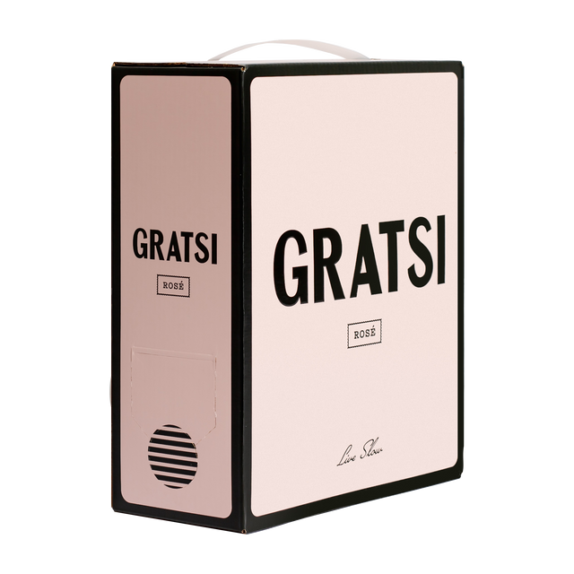 A light pink Gratsi Rosé wine box from the South of France displays bold black text on the front and side, a small label, and features a circular dispenser near the bottom.