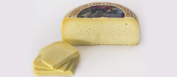 A round wheel of semi-hard cheese with a cut section showing its pale yellow interior, next to several thin, rectangular slices of the cheese, all set on a white background.
