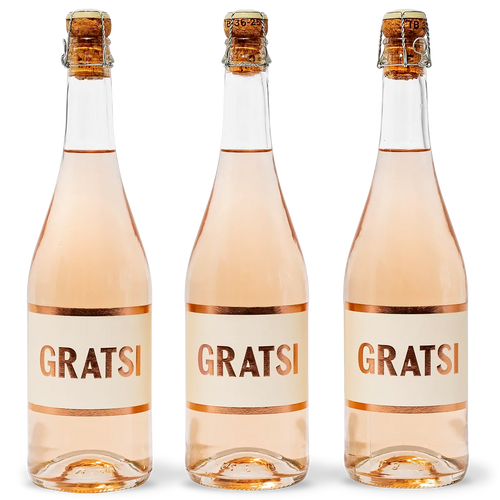 Three bottles of rosé wine with cork tops and white labels that read GRATSI in bold, copper-colored letters, displayed side by side on a white background.