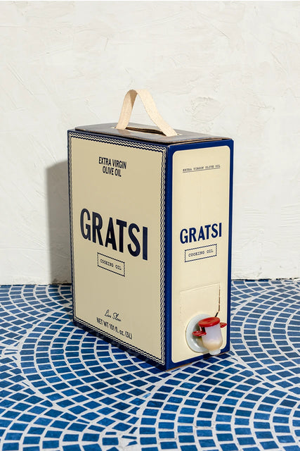 A rectangular box of Gratsi Cooking Oil, 100% Greek Extra Virgin Olive Oil, featuring a carrying handle on top and a dispensing spigot on the front.